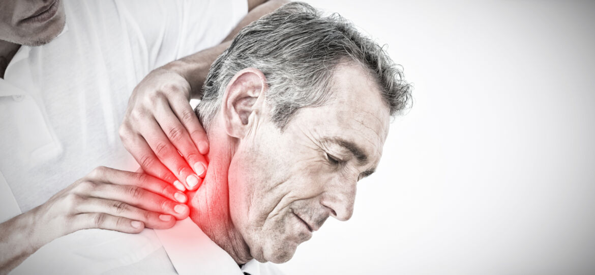 Male chiropractor massaging patients neck against highlighted pain_1600