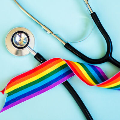 LGBTQ ribbon with doctor's stethoscope for gender-affirming care