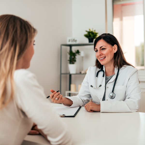 Beautiful,Female,Doctor,Discussing,Patients,Treatment,With,Her.